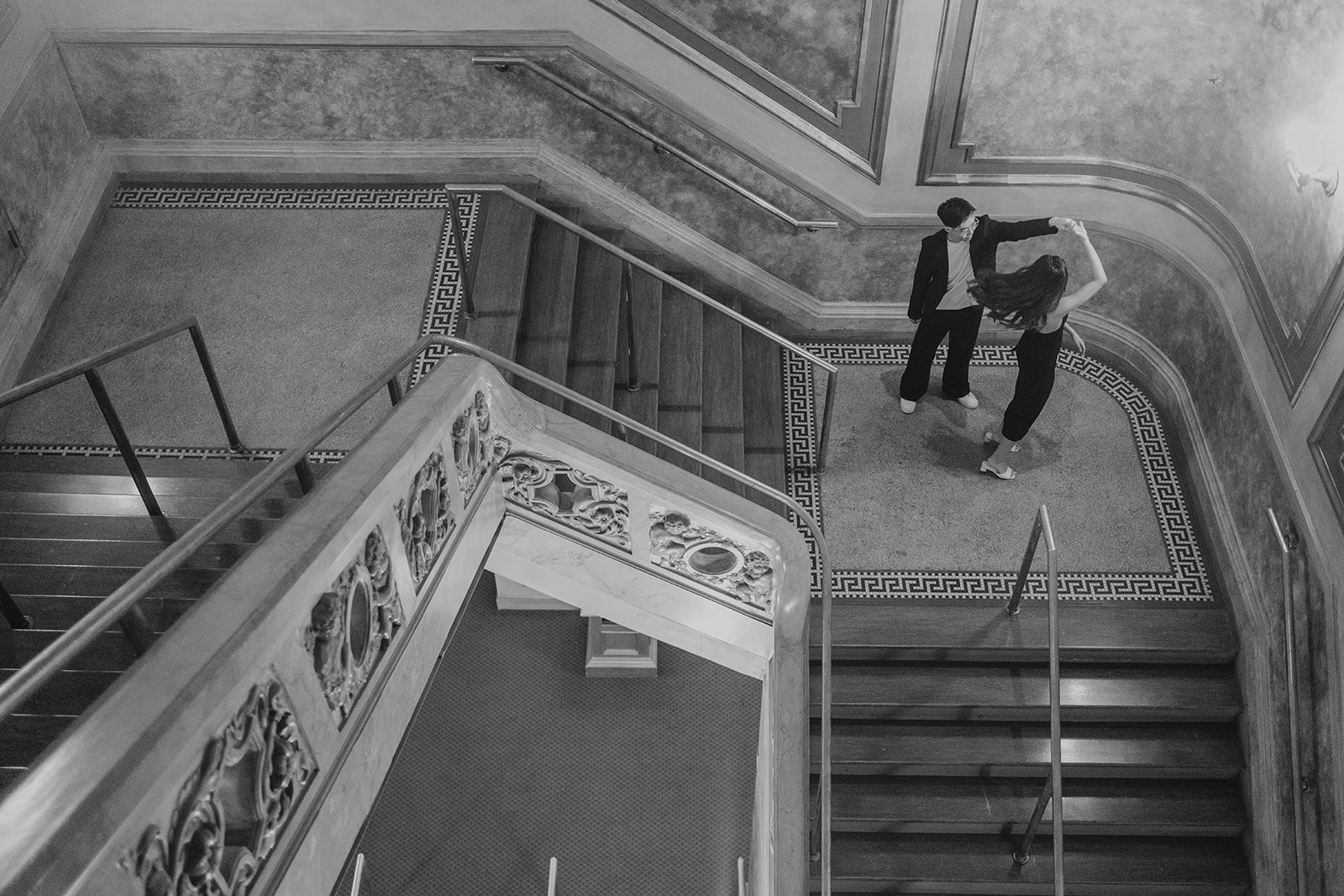 Bryan and Sheryl on the theatre staircase, in black and white